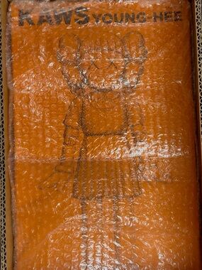 KAWS Orange Young-Hee figure